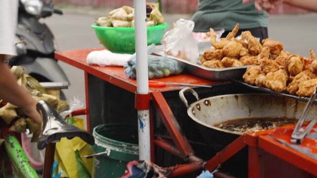 Customer Paying and Taking Out Fried Chicken at Street Food Market