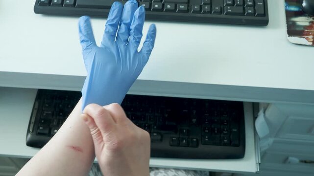 Treating thumb tendon pain beside keyboard in home office workspace