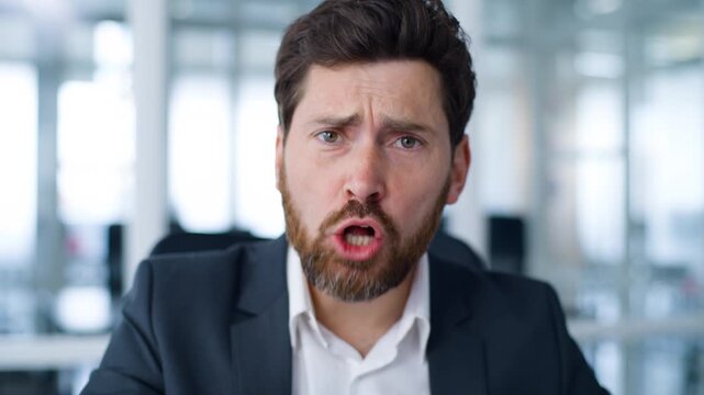 Web cam view portrait Caucasian mature business man angry mad yelling talking rude argument scolding irritated furious middle-aged businessman yell talk about bad work failure annoyed male in office