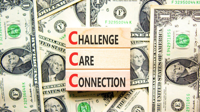 CCC challenge care connection symbol. Concept words CCC challenge care connection on beautiful wooden blocks. Beautiful dollar background. Business CCC challenge care connection concept. Copy space.