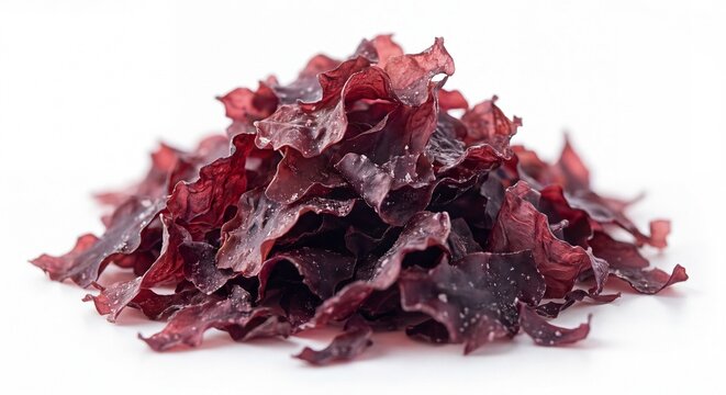 A pile of dried dulse seaweed flakes presented as a raw organic snack on a clean white background.