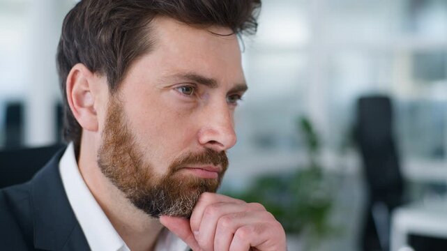 Close up portrait puzzled Caucasian mature business man thinking work question pensive employer think about job holding chin middle-aged businessman 40s male thoughtful face expression agent in office