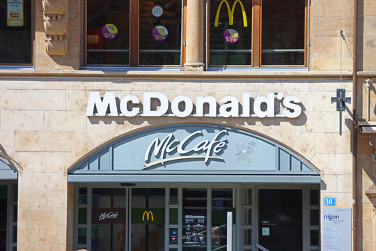 Basel, Switzerland, May 24, 2026: McDonald's McCafe Exterior with Logo in Urban Setting for Advertising and Branding