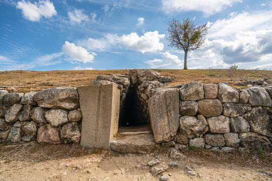 The historic stone postern tunnel beneath the Yerkapi rampart in the upper city of Hattusa. This defensive underground tunnel showcases the advanced military engineering and fortifications built by th