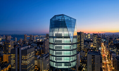 Obraz premium Futuristic glass skyscraper data center in modern city at dusk, urban skyline with server racks visible through illuminated glass facade,
