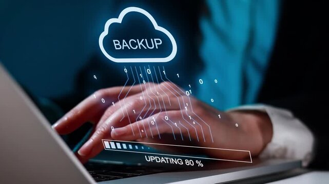 Person using a laptop for cloud backup with data updating in a digital environment