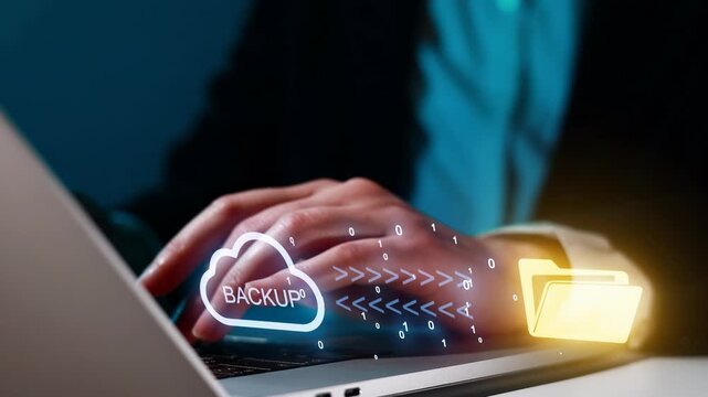 Cloud backup process done on a laptop with hands typing near digital icons showing data transfer and storage options
