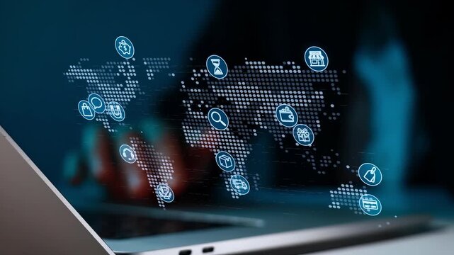 Digital map displays various icons while a person types on a laptop in a dark environment during night hours