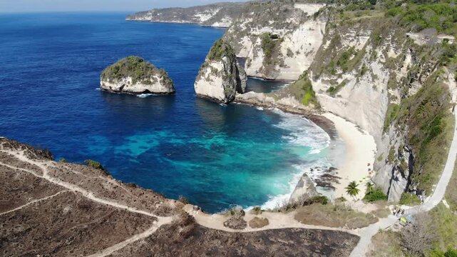 Aerial drone reveal over clifftop exposing Diamond Beach &ndash; Nusa Penida, Bali, Indonesia