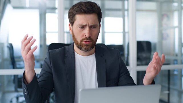 Caucasian business man working laptop online failure upset with losing data unsaved information cyberspace problem middle-aged businessman failed work with computer mature male frustrated in office
