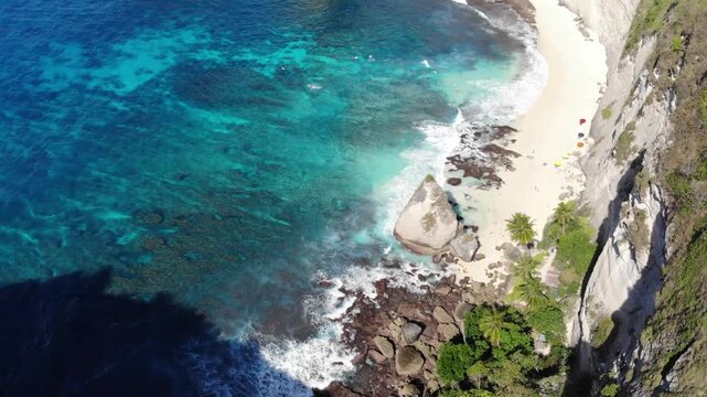 Aerial drone reveal over clifftop exposing Diamond Beach &ndash; Nusa Penida, Bali, Indonesia