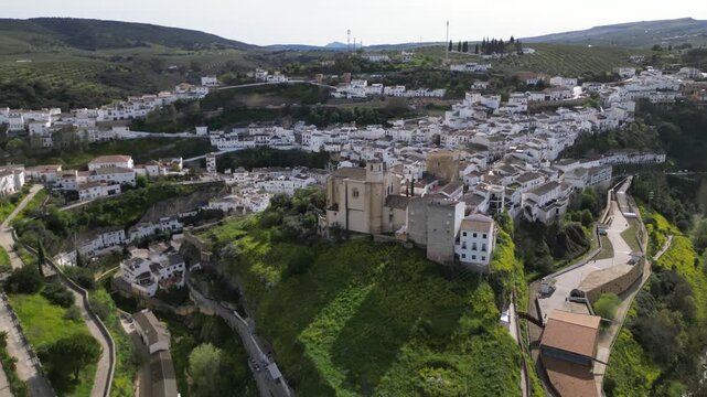 Aerial drone orbit around church in Setenil de las Bodegas, Andalusia, Spain