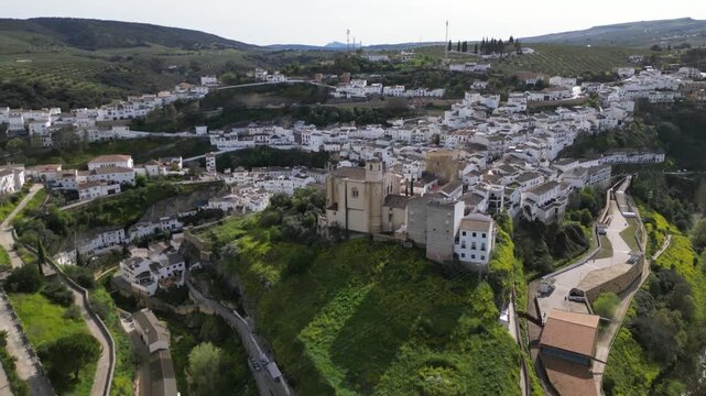 Aerial drone orbit around church in Setenil de las Bodegas, Andalusia, Spain