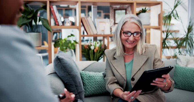 Meeting, old woman and tablet with financial advisor shaking hands in home for agreement or deal. App, handshake and finance with senior person speaking to agent or broker in apartment for consulting
