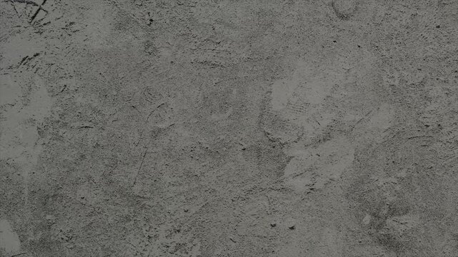 A close up view of the textured concrete wall surface.