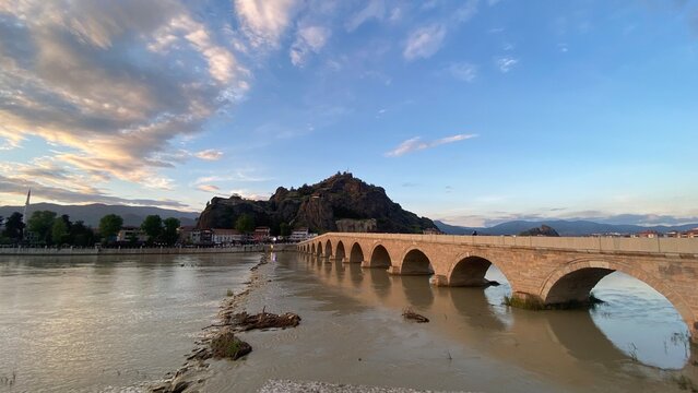 Historic Koyunbaba Bridge spanning the Kızılırmak River in Osmancık, &Ccedil;orum, T&uuml;rkiye. This magnificent 15th-century Ottoman stone arch bridge, built during the reign of Sultan Bayezid II, stands as one