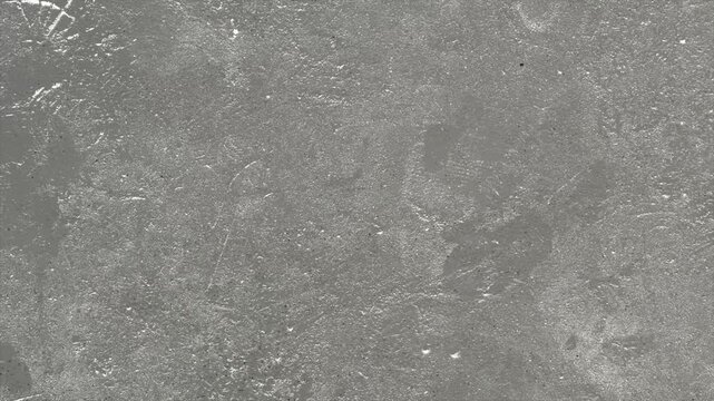 Abstract grey concrete texture with weathered surface details.