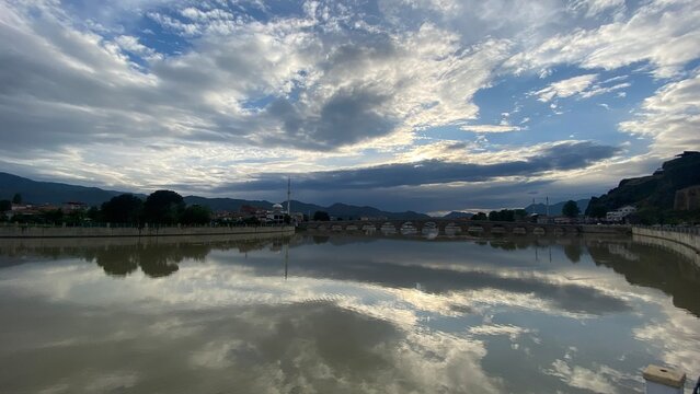 Panoramic view from Osmancık Castle overlooking the historic Koyunbaba Bridge, the winding Kızılırmak River, and the town of Osmancık in &Ccedil;orum, T&uuml;rkiye. This breathtaking landscape combines centuries 