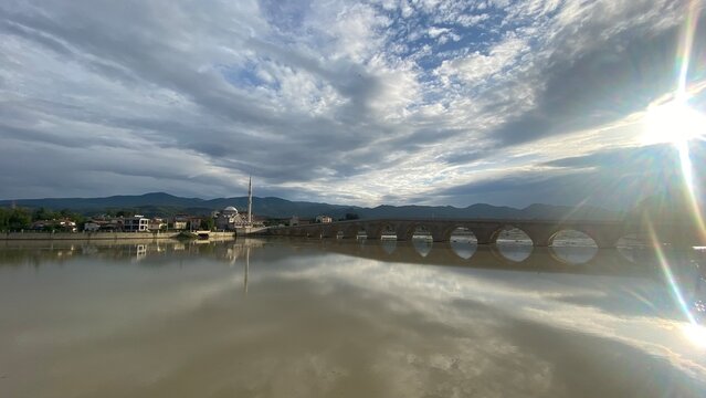 Historic Koyunbaba Bridge spanning the Kızılırmak River in Osmancık, &Ccedil;orum, T&uuml;rkiye. This magnificent 15th-century Ottoman stone arch bridge, built during the reign of Sultan Bayezid II, stands as one