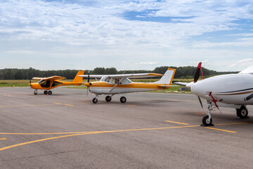 Fototapeta premium Small private aircrafts parked at the airfield