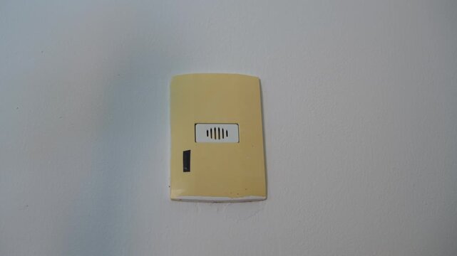 High-quality sound recording in uncompressed WAV format of a wall-mounted doorbell ringing loudly, with a sharp metallic buzzing and scraping electric bell sound for Foley, editing, and audio library