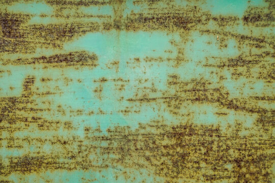 Rusty green metal surface with horizontal scratches and corrosion texture background
