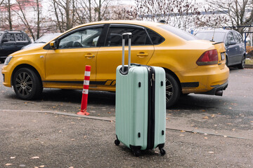 Naklejka premium suitcase, backpack, travel bag next to the car in the parking lot