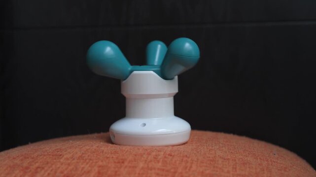 High-quality sound recording in uncompressed WAV format of a portable electric vibration massager working on a table, with a steady buzzing personal care sound for Foley, editing, and audio library