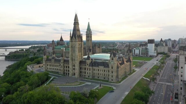 Parliament Hill Ottawa Canada Aerial Drone View at Sunset with Peace Tower and Ottawa River