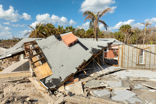 Ruined buildings in need of demolition or repair. Storm surge water and wind damaged houses roof and collapsed walls after hurricane in Florida