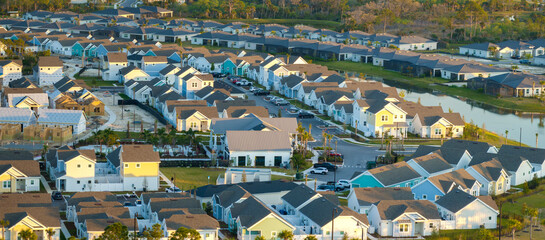 Fototapeta premium Construction in new developing suburban area. Development of residential housing in American suburbs. Real estate market in the USA