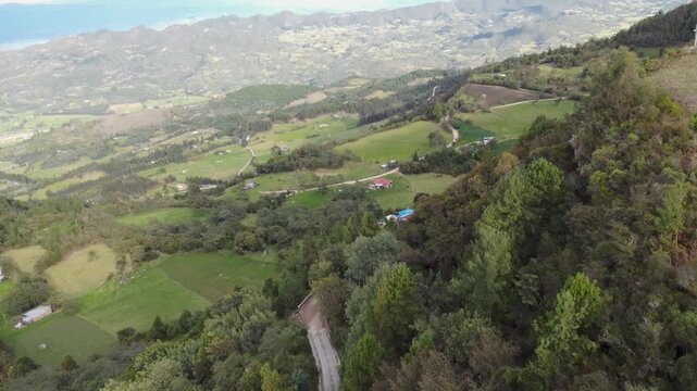 rone aerial view Mountain piedra colgada, Colombia Latin America, tree zone forest nature area, landscape scenary blue sky 4k