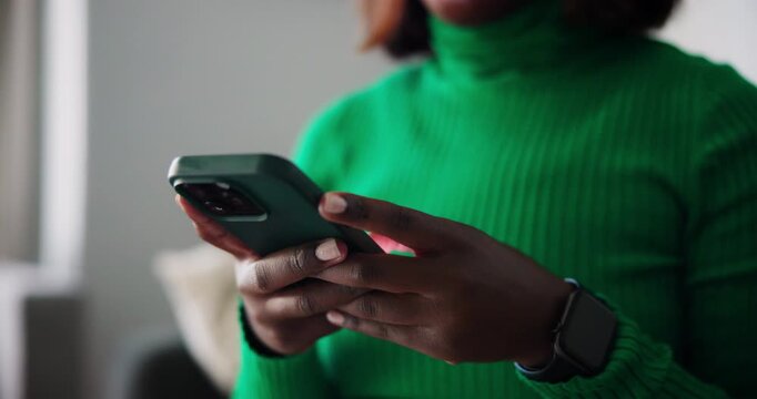 Black Woman's Hands Typing on a Modern Smartphone Device for Communication and Connection