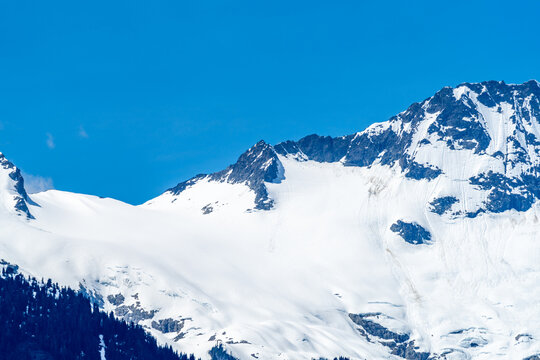Snow Covered Slopes of Mount Tantalus Under Clear Blue Sky