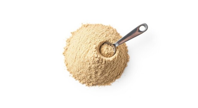 Pile of golden maca powder with metal measuring spoon