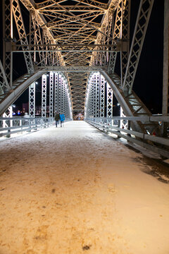 The first arch bridge built in Russia&mdash;the Belelyubsky Bridge&mdash;features architectural and artistic nighttime illumination. Borovichi, Novgorod Oblast, Russia.