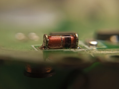 Close up of MELF diode components on a circuit board (Metal Electrode Leadless Face) SMD type