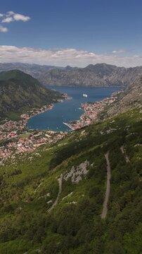 Kotor Montenegro 4K Vertical Aerial Video, 9:16 Portrait Drone Fly Forward Over Winding Serpentine Mountain Road with Panoramic View of Bay of Kotor