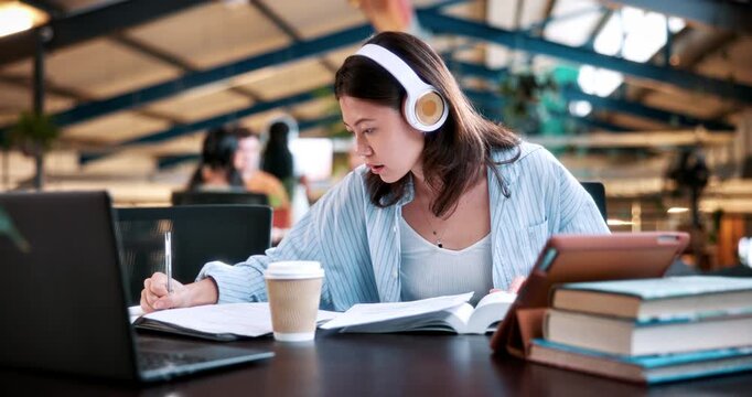Woman, student and writing with headphones in university study for education, learning or knowledge. Female person, learner or dictionary with sound app for language, audio translation or research