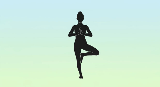Woman in yoga tree pose silhouette.