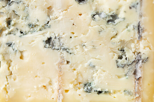 Blue cheese texture showing mold veins and organic patterns of dairy product. Macro shot. Close up. Copy space.