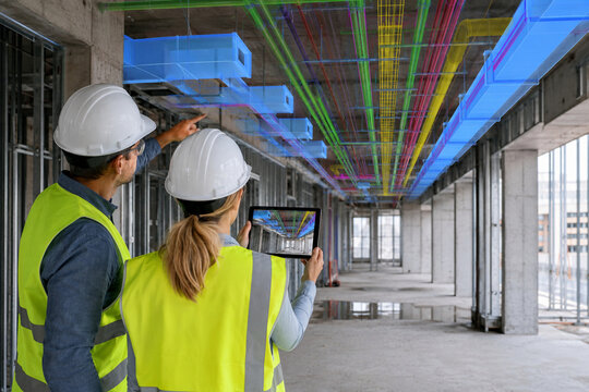 Engineers Using Augmented Reality MEP Ceiling Overlay with Tablet at Construction Site generative ai