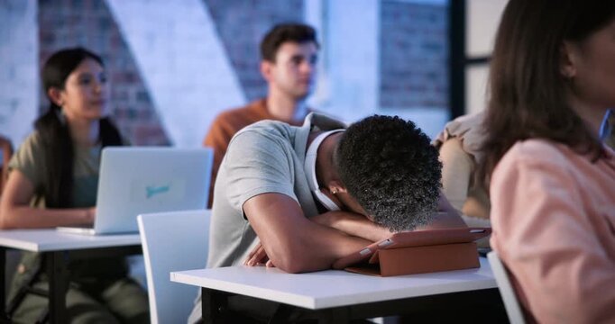 University, tired man and student sleep with education burnout, study fatigue or bored in class. College, nap and exhausted person with learning difficulty, low energy or lazy at lecture with tablet