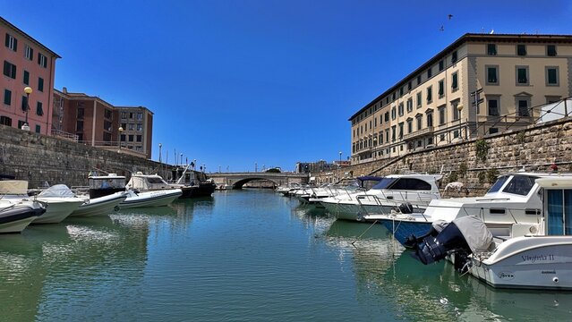 Livorno, Tuscany, Italy &ndash; 27 June 2026: A picturesque view of Livorno&rsquo;s canal in the Venezia district, with its vibrant architecture and boats moored in the city&rsquo;s historic centre