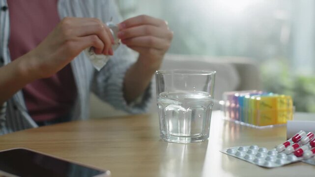 Person Dropping Effervescent Tablet into Glass of Water in 4K, Healthcare Concept