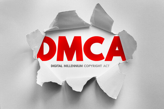 DMCA text revealed through torn paper effect, showing a legal technology concept related to copyright protection, digital media control and rights enforcement