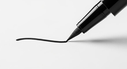 Fototapeta premium Liquid eyeliner pen tip drawing a precise black line on a clean white surface. Concept of makeup precision, beauty routine, and cosmetic application