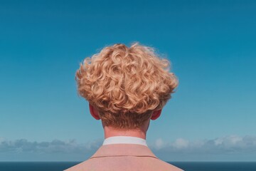 Fototapeta premium Looking towards the endless ocean under a bright blue sky