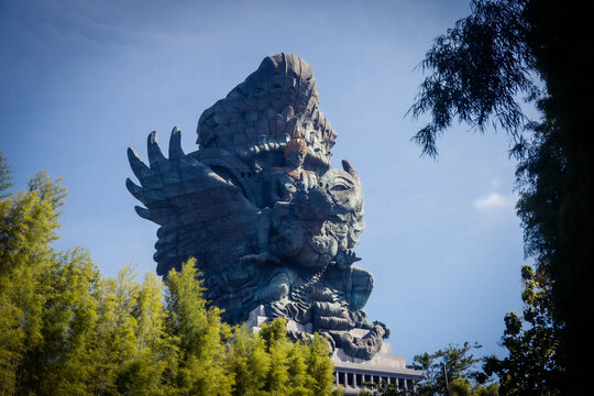 Garuda Wisnu Kencana Statue Rising Above Tropical Landscape in Bali Indonesia