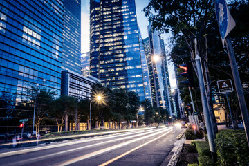 Obraz premium Modern Financial District Street with Light Trails in Singapore at Blue Hour